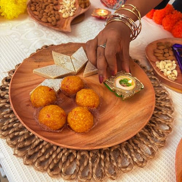 A person carefully arranging delicious food on a plate, ready to serve a tasty meal.