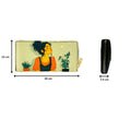 A stylish clutch purse featuring a woman's face design alongside a vibrant plant illustration. 